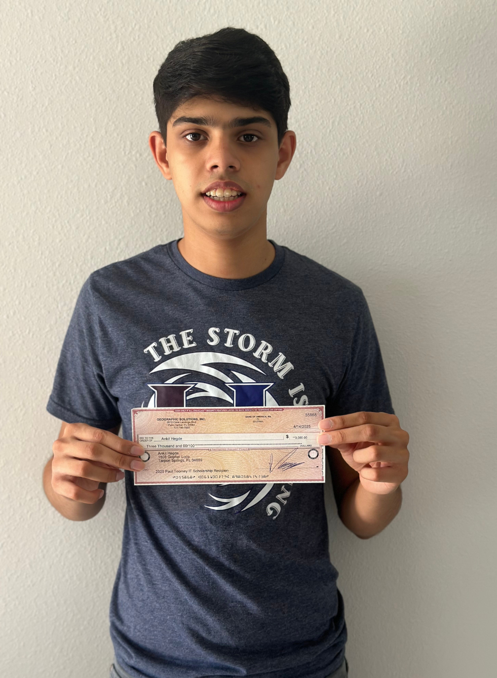 Ankit Hegde holding IT Scholarship Award check